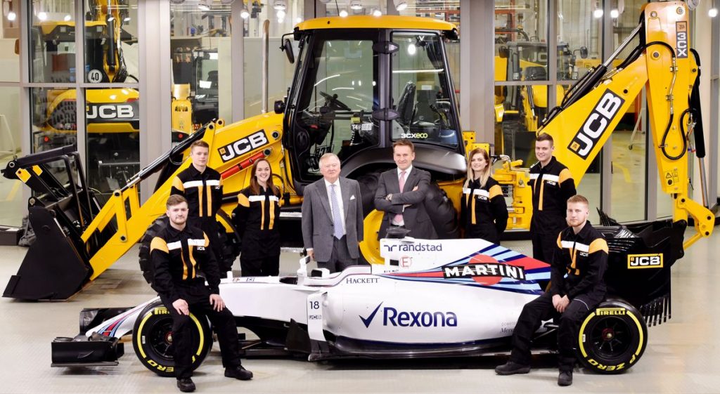 JCB Chairman Lord Bamford (centre left) and JCB CEO Graeme Macdonald pictured with JCB apprentices (l-r) Kyle Hare , Charlie Trotter, Jade Holmes, Chelsea Saunders, James Mohan and Daniel Malbon at the announcement of the new partnership agreement between JCB and Williams Martini Racing.