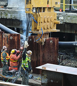 Removing sheet piles used to separate construction activity from Elliott Bay
