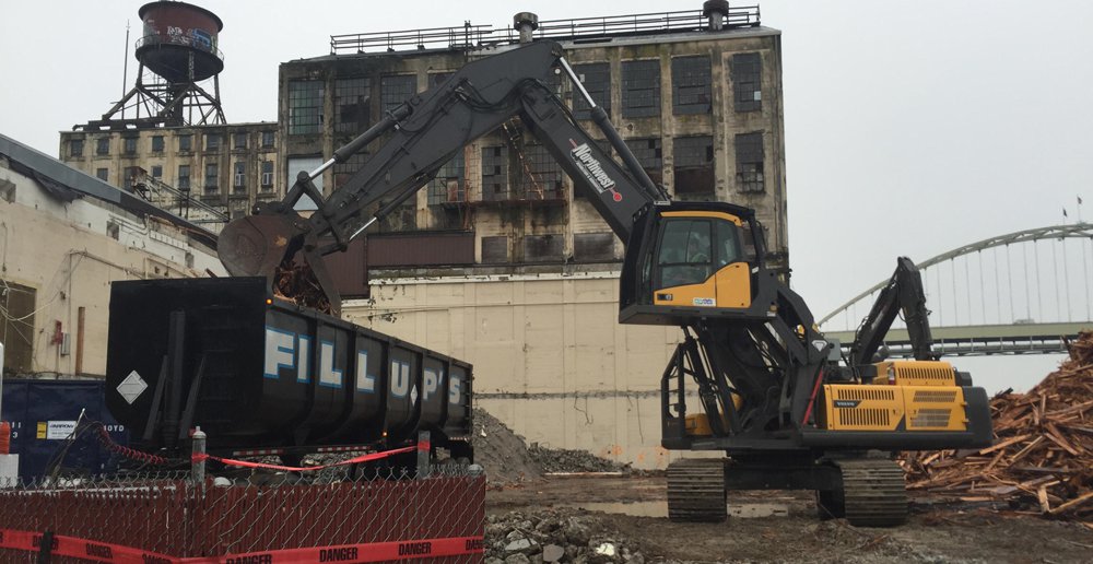 Northwest Demolition has outfitted their Volvo excavators with a unique cab lift that resembles a scrap-handling machine