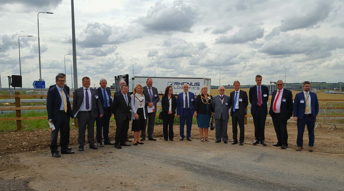 Bedfordshire business and civic leaders near the A5-M1 link road and M1 junction 11A today