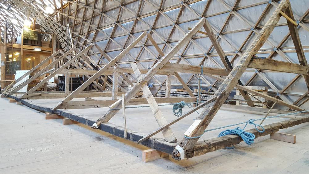An ancient barn is being preserved at a museum
