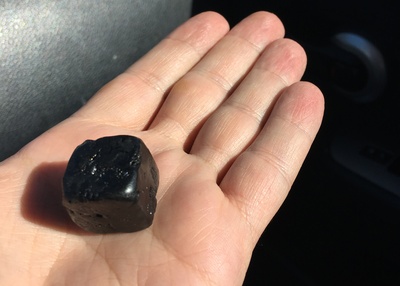 Bitumen balls can range from golfball- to pill-size. Photo courtesy Innovate Calgary