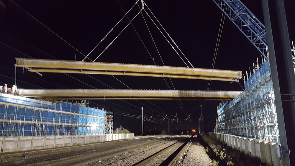 New A14 Cambridge to Huntingdon bridge beams lifted over major railway line