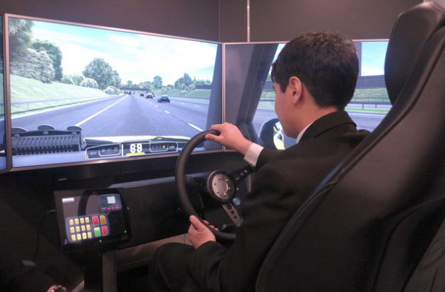 A Big Bang Fair visitor experiences the Highways England simulator