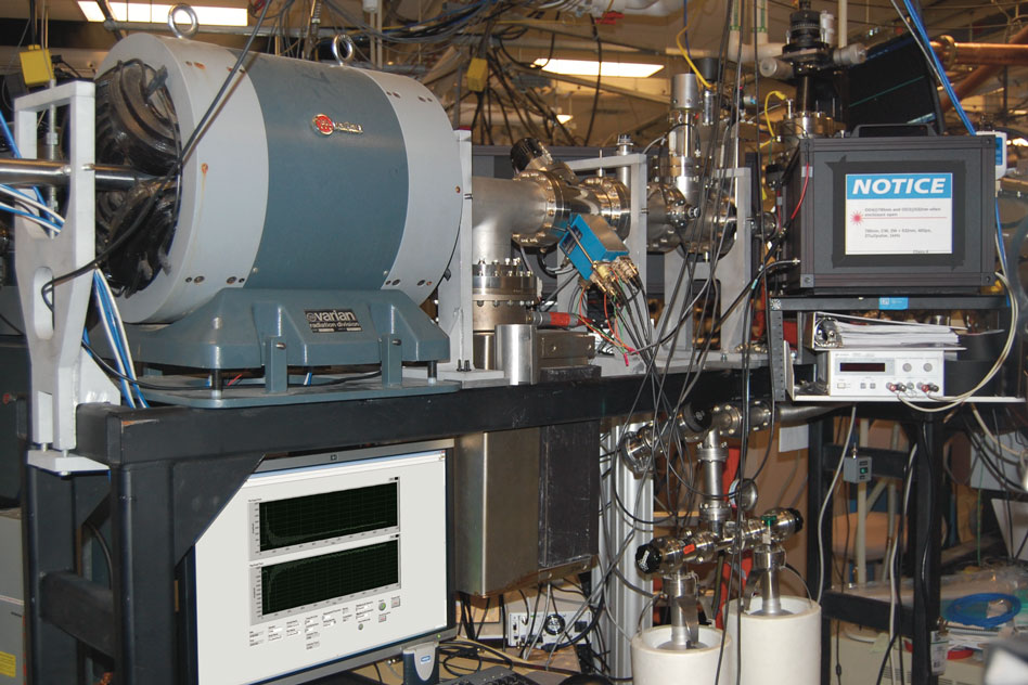The ion beamline at Sandia National Labs where the new radiation damage measurement system has been installed and tested. The radiation damage process is observed in a target chamber located behind the black-box laser enclosure on the right of the image.  Image: Cody Dennett